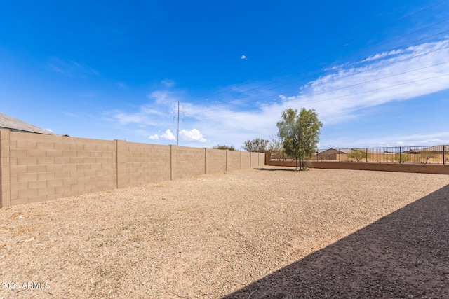 view of yard with a fenced backyard