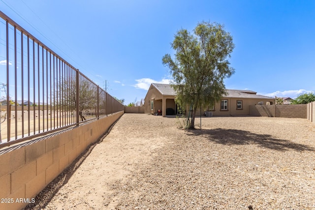 view of yard with a fenced backyard