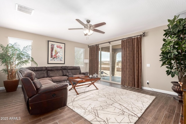 living room with visible vents, ceiling fan, plenty of natural light, and wood finish floors