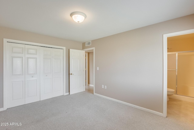 unfurnished bedroom featuring carpet, visible vents, and baseboards