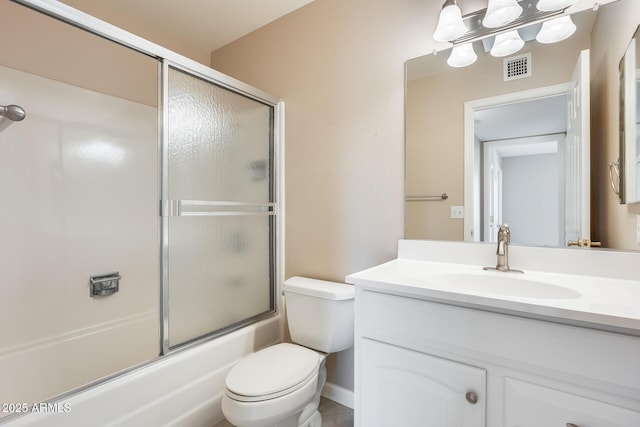 bathroom featuring toilet, shower / bath combination with glass door, vanity, and visible vents