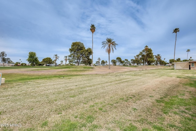 view of property's community with a lawn