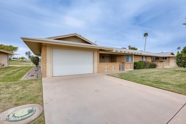 ranch-style house featuring a garage, a front lawn, concrete driveway, and brick siding