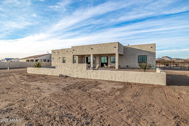 back of property featuring a patio