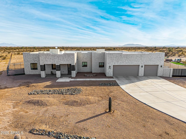 view of front facade featuring a mountain view and a garage