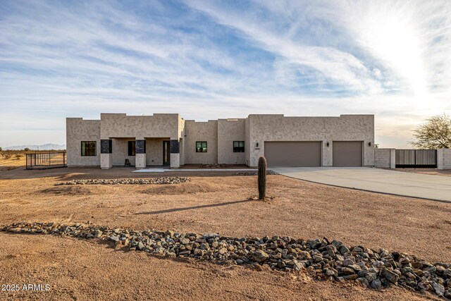 southwest-style home featuring a garage