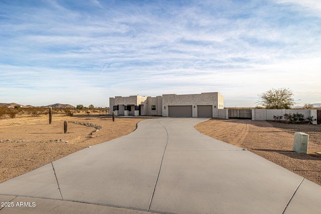 view of front facade with a garage and a mountain view