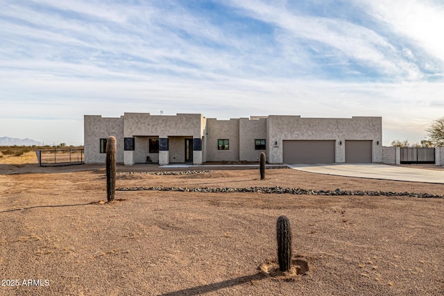 pueblo-style home with a garage