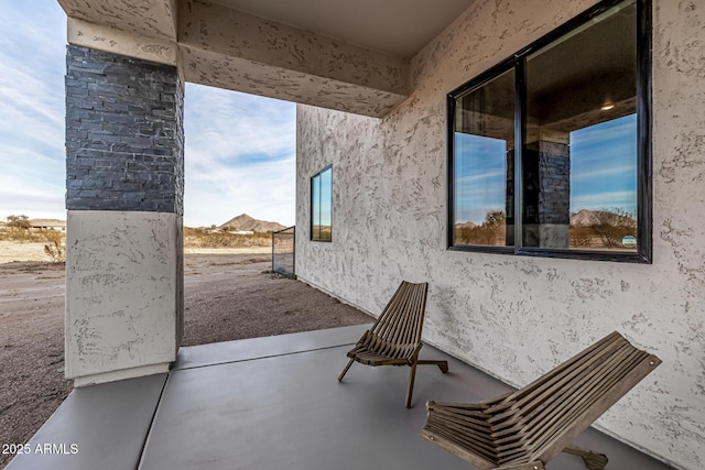 view of patio / terrace featuring a mountain view