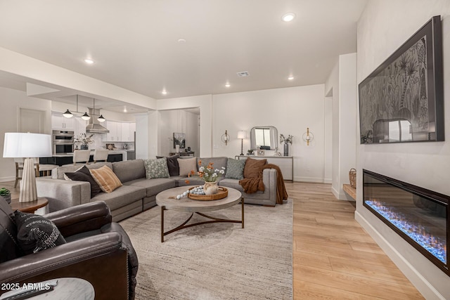 living room with light hardwood / wood-style floors