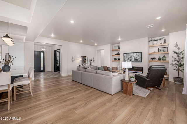 living room with light hardwood / wood-style floors