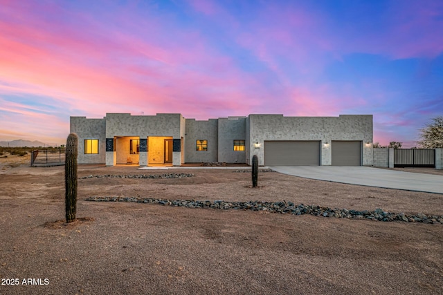 southwest-style home featuring a garage