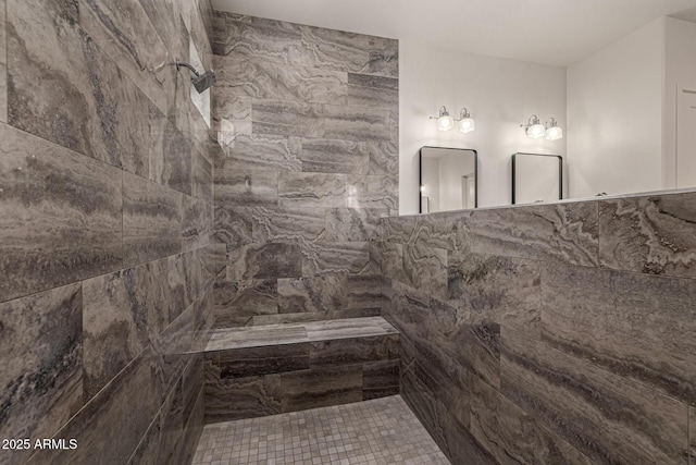 bathroom featuring a tile shower