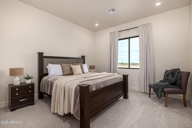 bedroom with light colored carpet