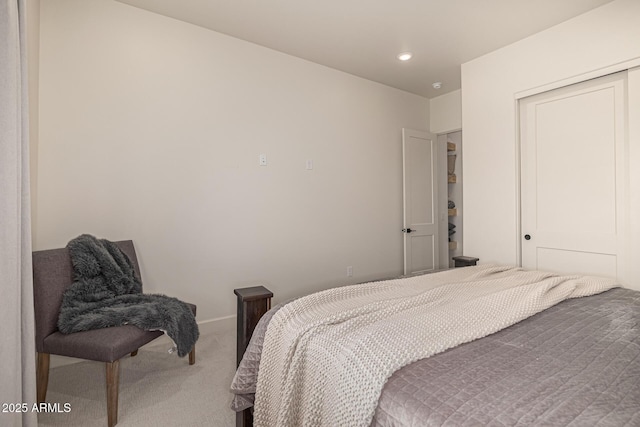 carpeted bedroom with a closet