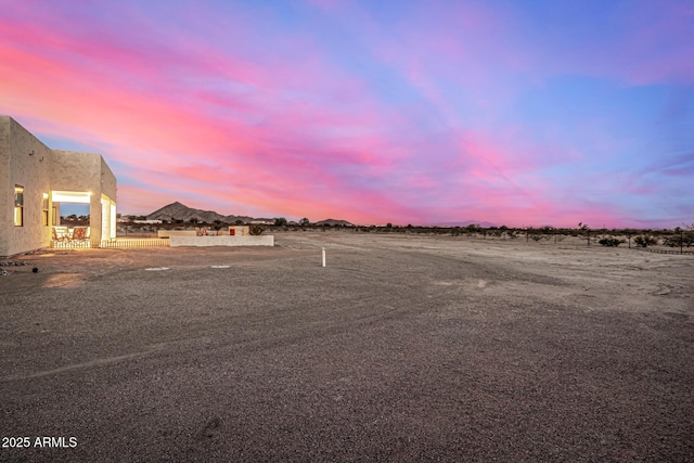 view of yard at dusk