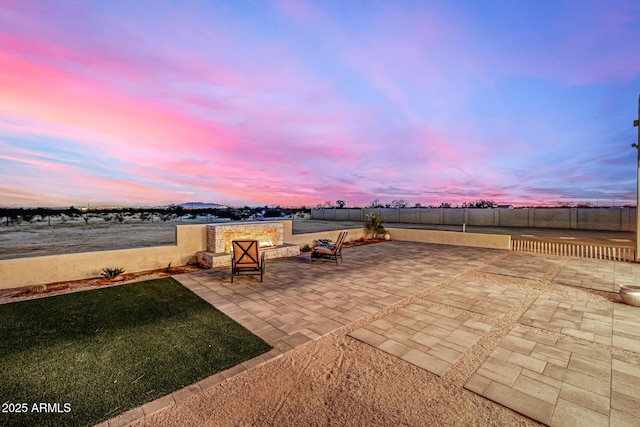 view of patio terrace at dusk