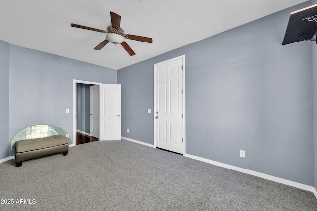 unfurnished bedroom featuring ceiling fan and carpet flooring