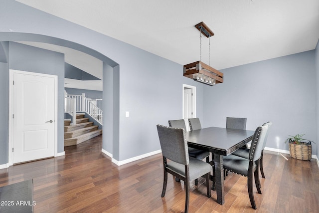 dining space featuring dark wood-type flooring