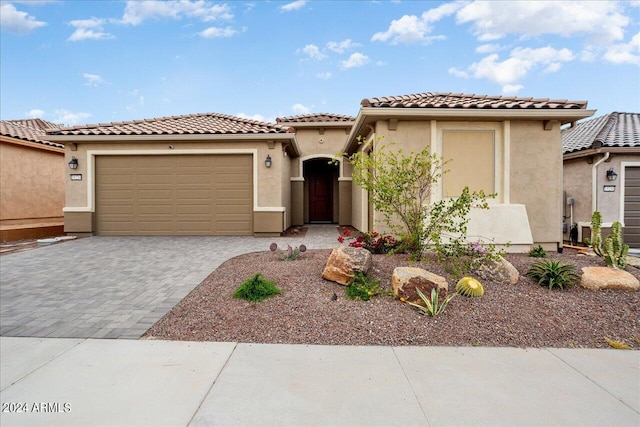 mediterranean / spanish-style house featuring a garage