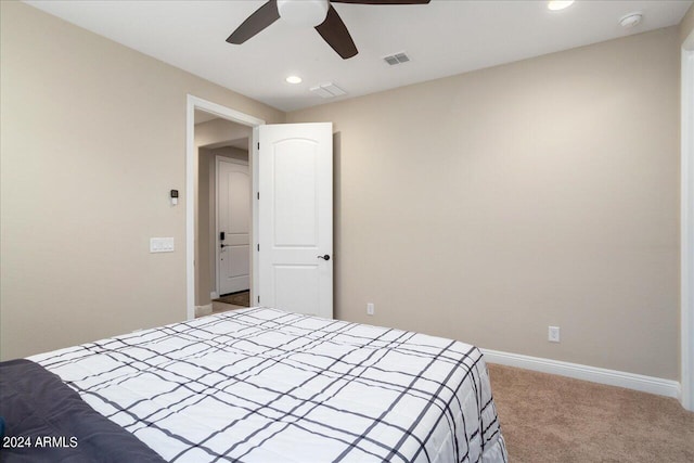 carpeted bedroom with ceiling fan