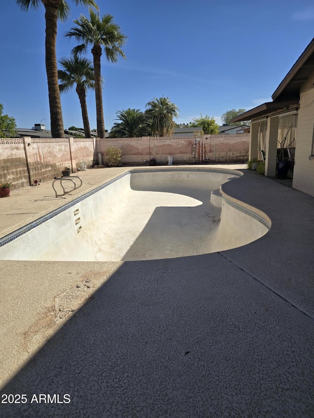 view of yard with a fenced in pool, a patio, and a fenced backyard