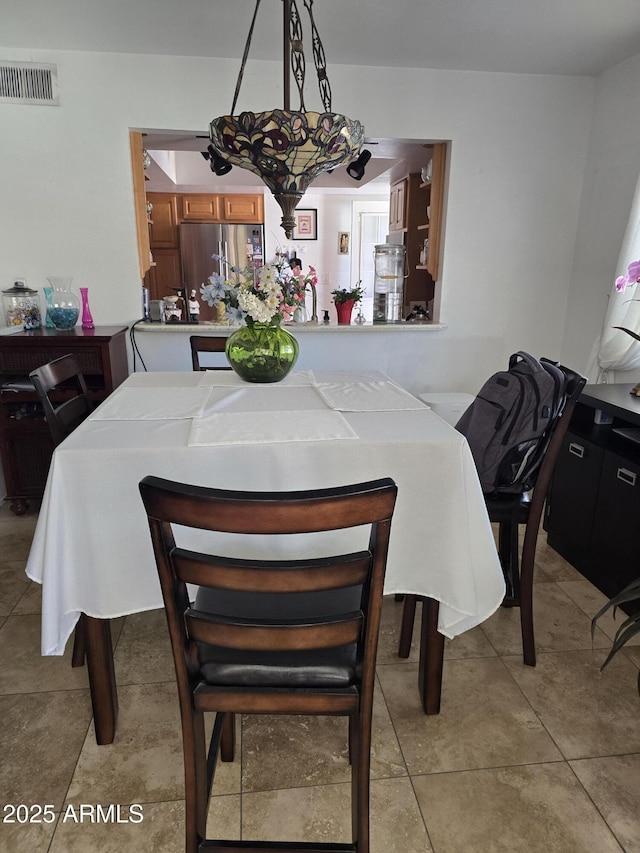 dining room with visible vents