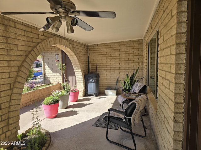 view of patio featuring ceiling fan
