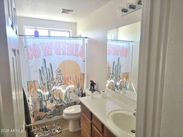 44583 W Sandstone Dr, Maricopa, AZ 85139 - bathroom featuring vanity, tile patterned floors, shower / bath combo, and a textured ceiling