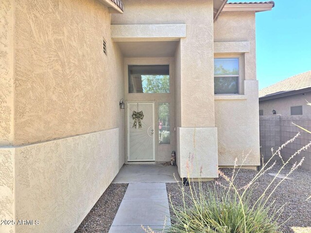 44583 W Sandstone Dr, Maricopa, AZ 85139 - doorway to property with stucco siding