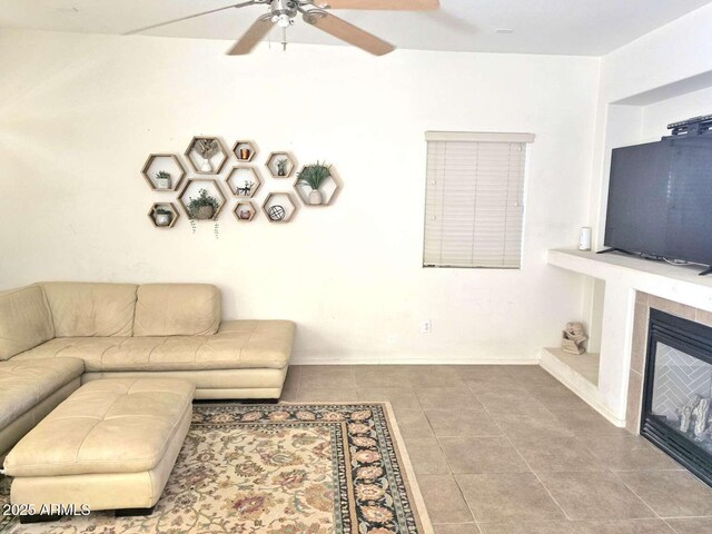 44583 W Sandstone Dr, Maricopa, AZ 85139 - tiled living area featuring a ceiling fan and a fireplace