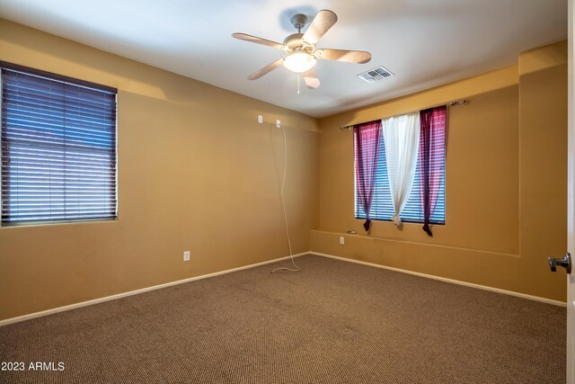 empty room with carpet and ceiling fan