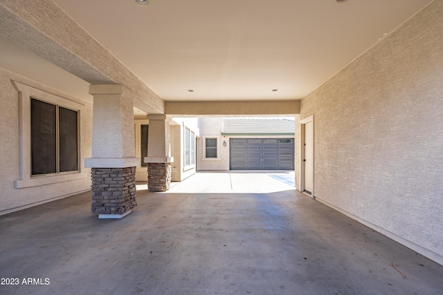 view of patio / terrace with a garage