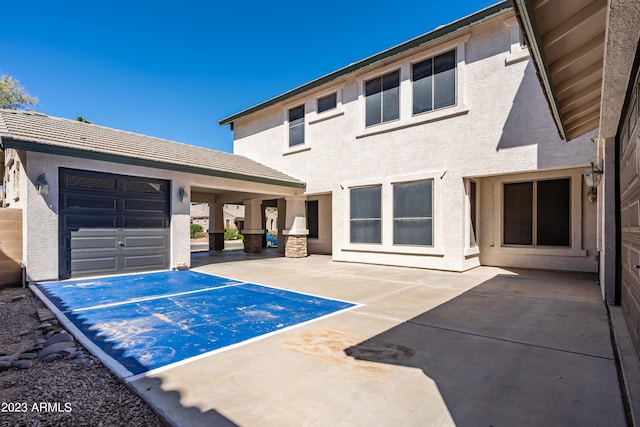 exterior space featuring a patio area and a garage