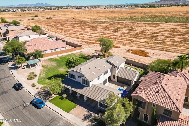 birds eye view of property featuring a mountain view