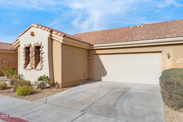 mediterranean / spanish home with a garage