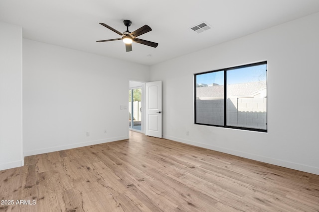 empty room featuring light hardwood / wood-style floors and ceiling fan