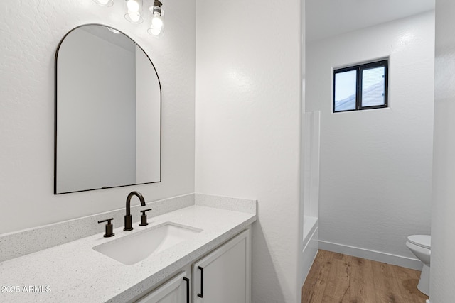 full bathroom with toilet, separate shower and tub, wood-type flooring, and vanity