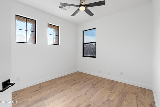 spare room featuring ceiling fan and light wood-type flooring