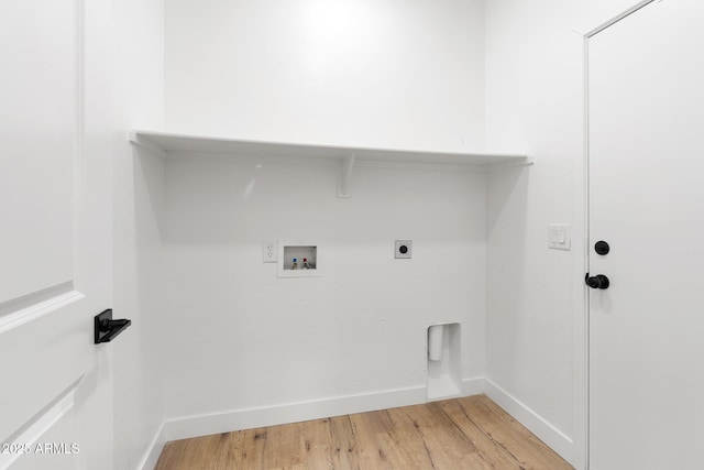 clothes washing area featuring washer hookup, hookup for an electric dryer, and hardwood / wood-style flooring