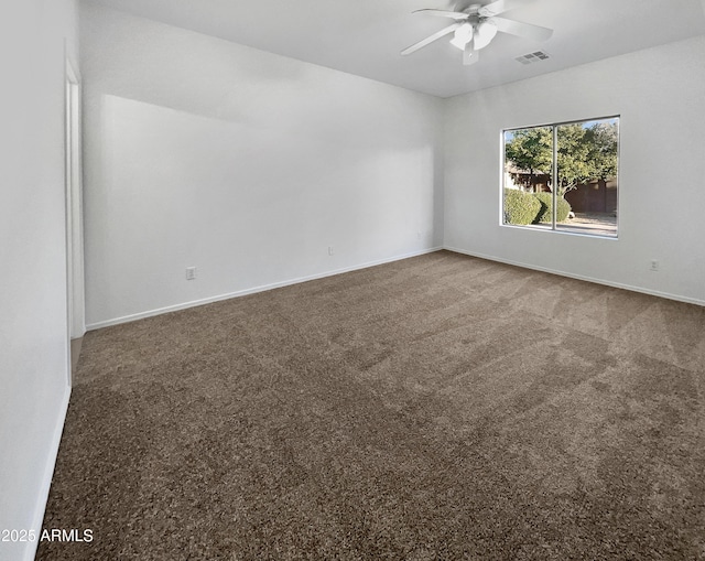 empty room with carpet flooring and ceiling fan