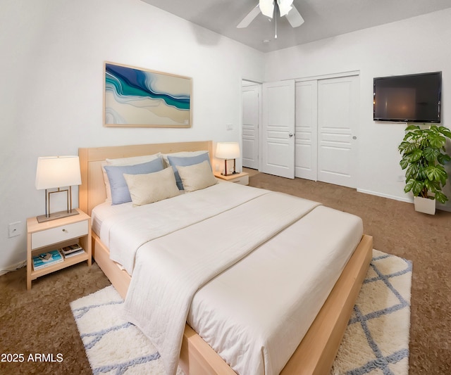 bedroom featuring dark colored carpet, a closet, and ceiling fan