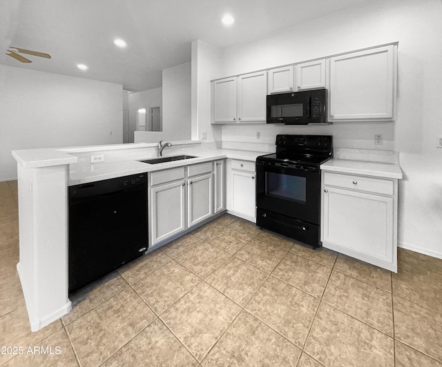 kitchen with kitchen peninsula, ceiling fan, sink, black appliances, and white cabinetry