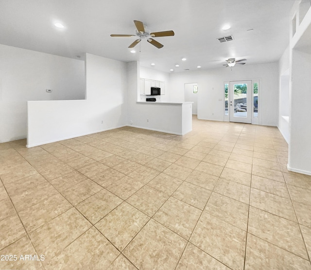 unfurnished living room with ceiling fan and light tile patterned flooring