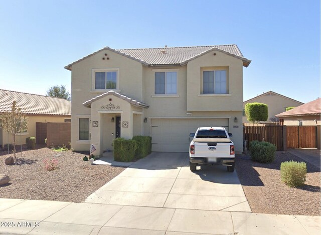 18629 W Fulton St, Goodyear, AZ 85338 - view of front of home with a tiled roof, stucco siding, a garage, concrete driveway, and fence