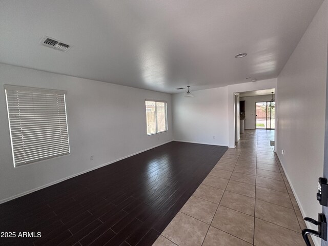 18629 W Fulton St, Goodyear, AZ 85338 - unfurnished room featuring healthy amount of natural light, baseboards, and wood finished floors