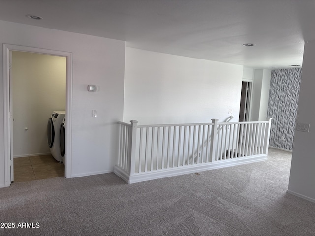 18629 W Fulton St, Goodyear, AZ 85338 - spare room with carpet floors, washer and dryer, and baseboards