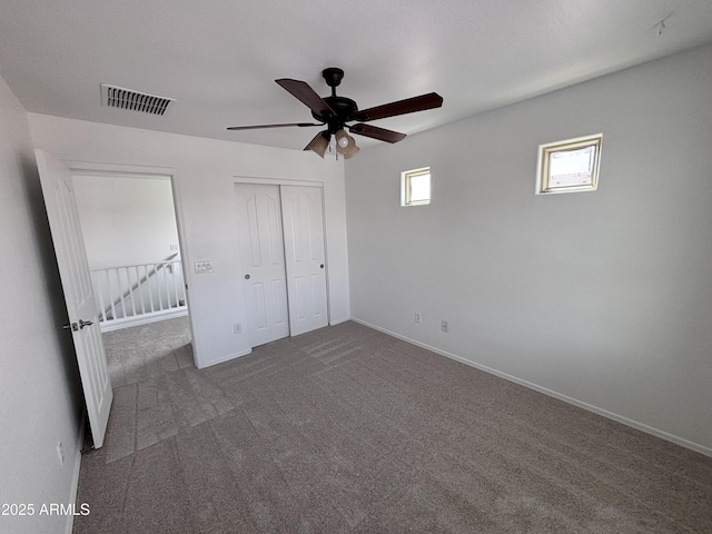 18629 W Fulton St, Goodyear, AZ 85338 - unfurnished bedroom featuring carpet, a closet, baseboards, and ceiling fan