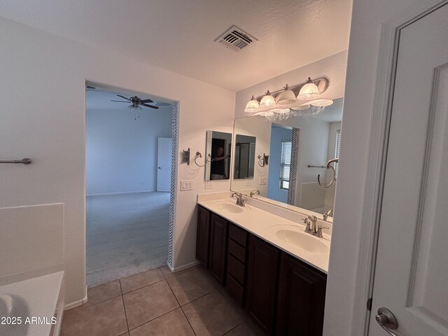 18629 W Fulton St, Goodyear, AZ 85338 - full bathroom with ceiling fan, tile patterned floors, double vanity, and baseboards