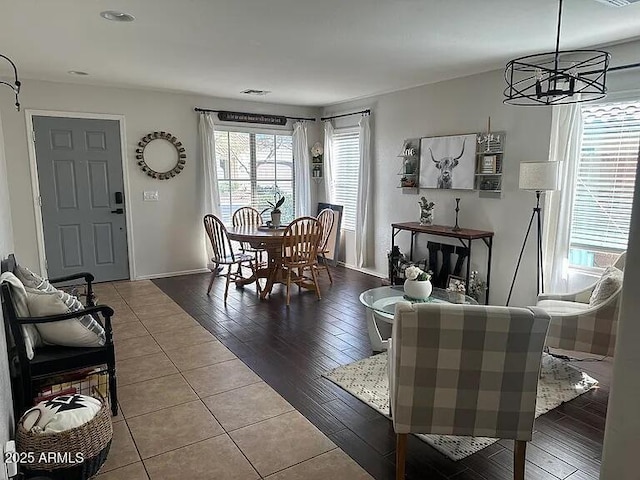 18629 W Fulton St, Goodyear, AZ 85338 - tiled dining room with baseboards and a chandelier